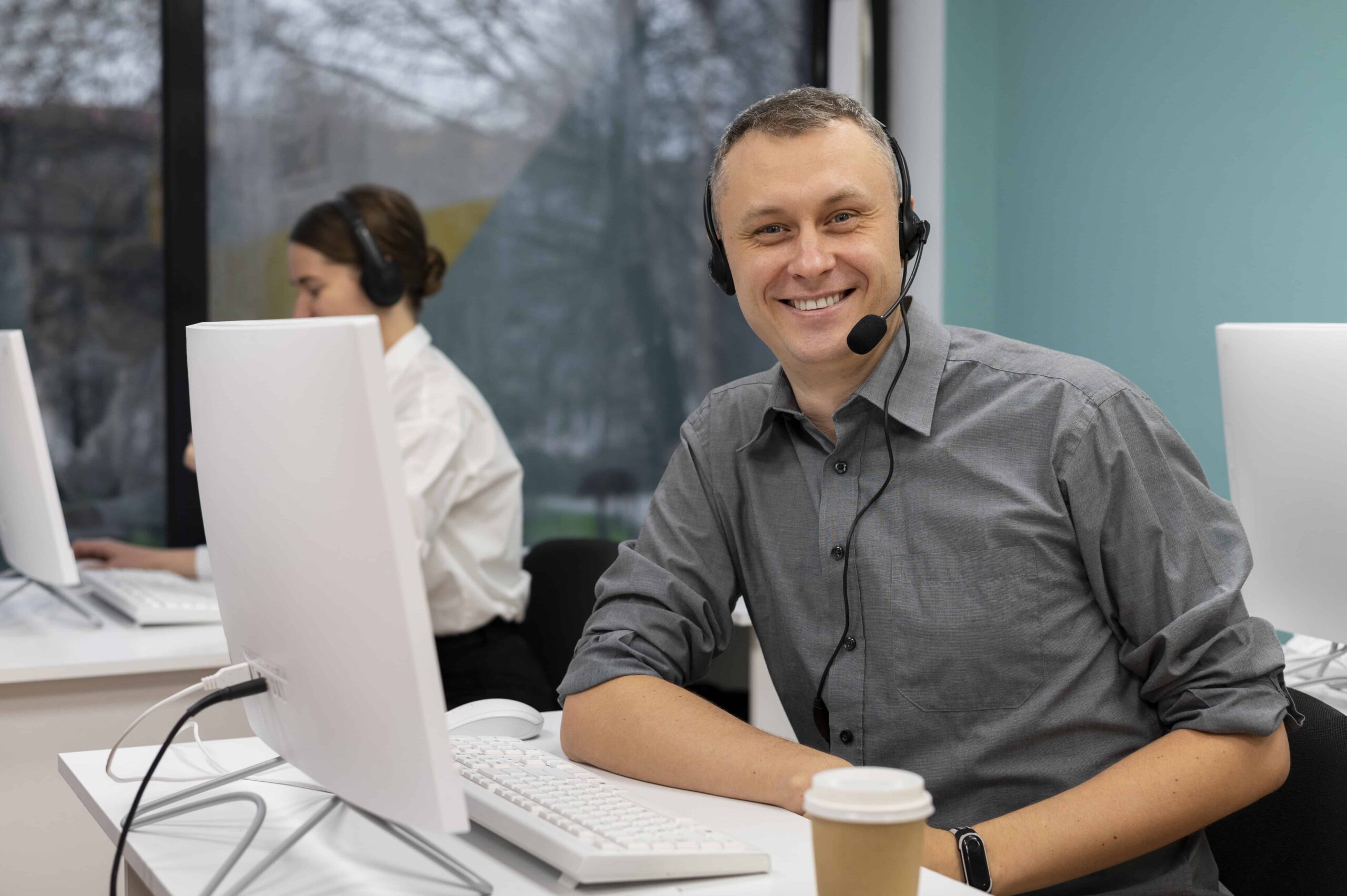 Man With Headphones Working at IT Service Provider in Winnipeg Man With Headphones Working at IT Service Provider in Winnipeg