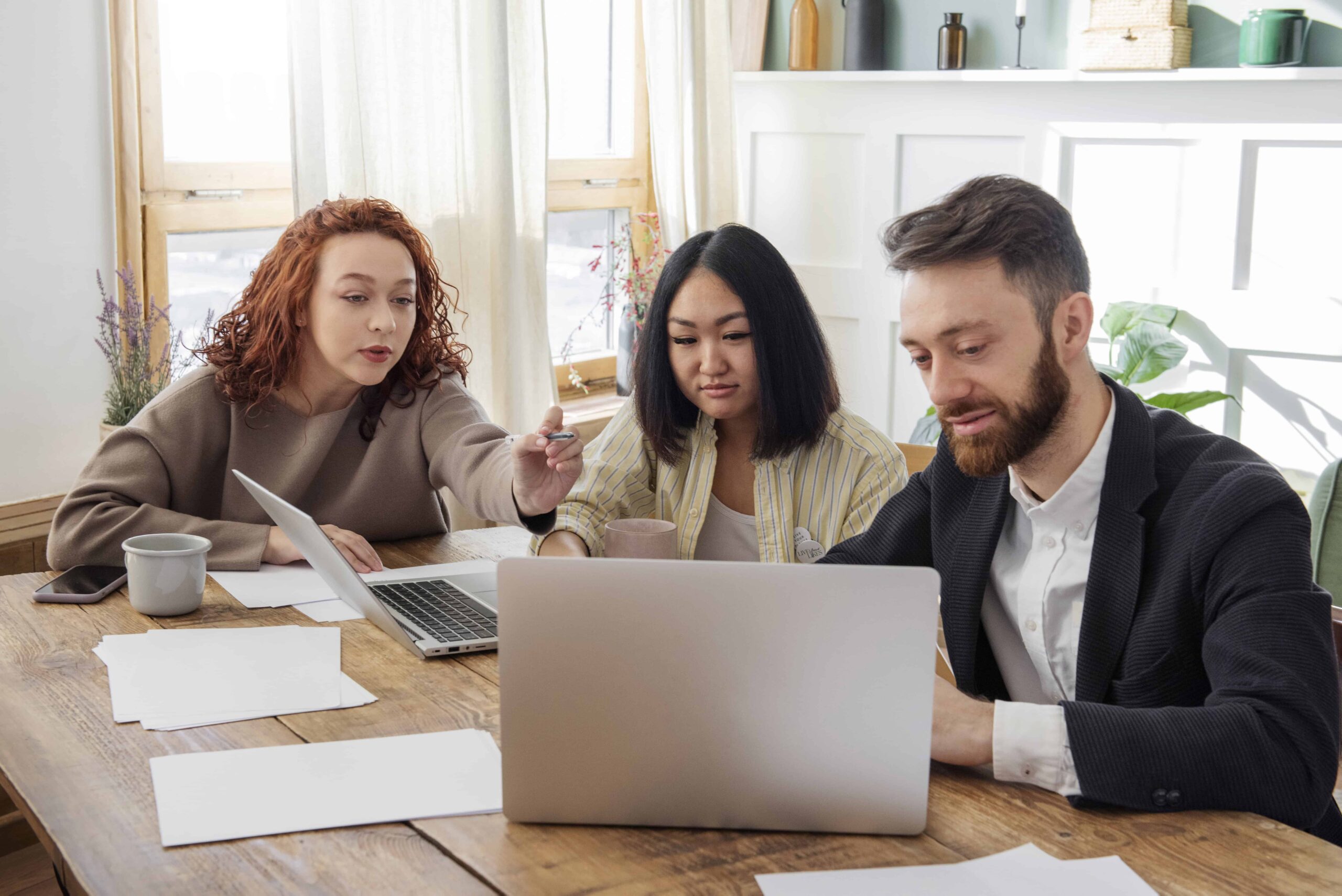 People Having Debate While Looking Computer (1)